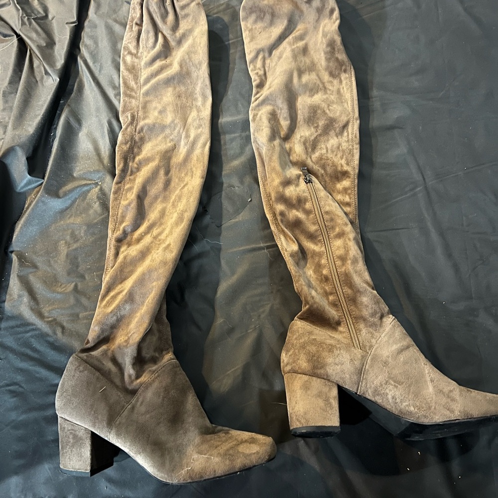 Thigh high boots with draw string.